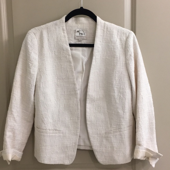white collarless jacket